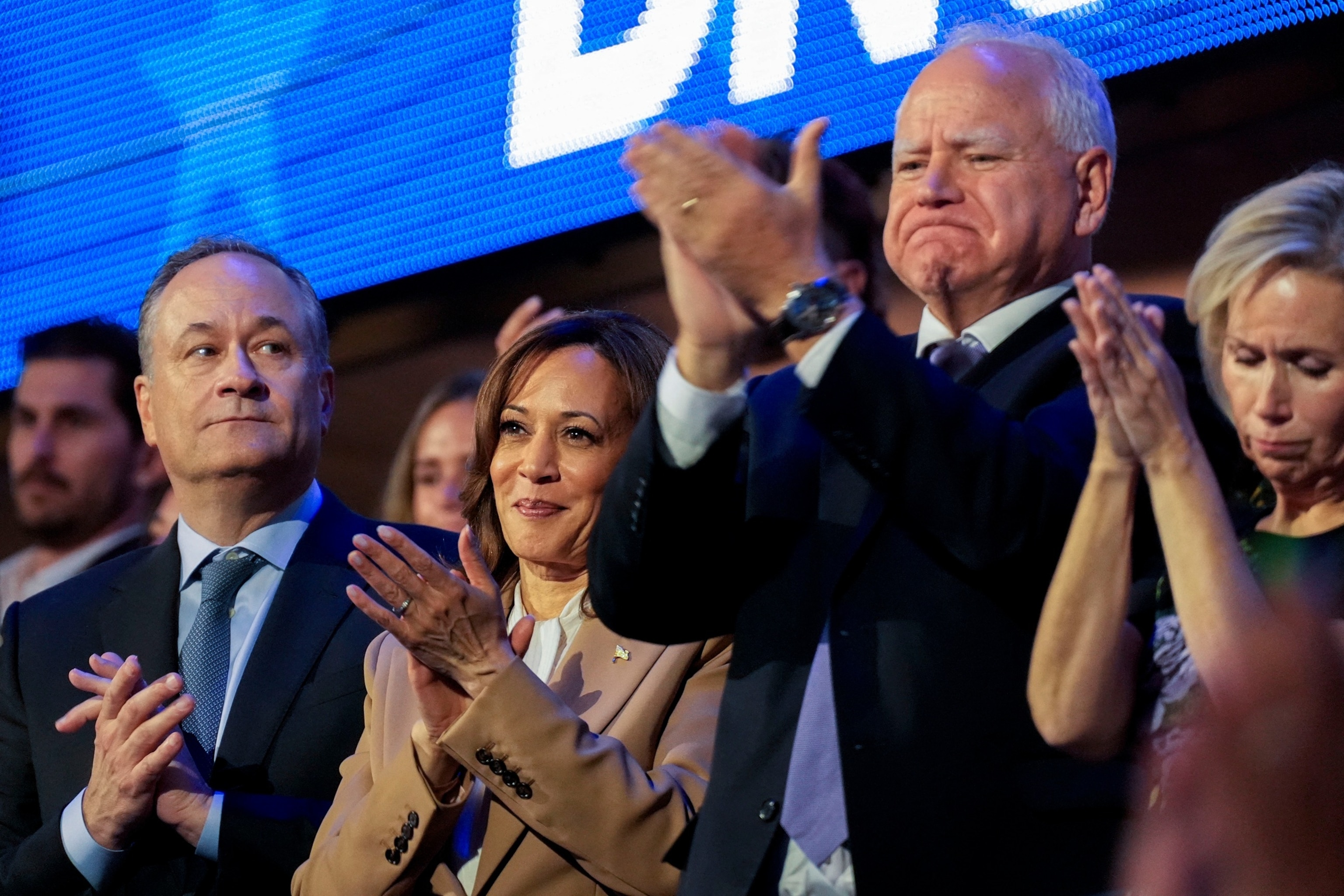 PHOTO: U.S. Vice President Kamala Harris, Second Gentleman Doug Emhoff, vice presidential candidate Minnesota Governor Tim Walz and Gwen Walz applaud as U.S. President Joe Biden speaks at the Democratic National Convention in Chicago, Aug. 19, 2024.